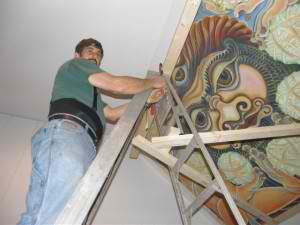 Nicholas paints the ceiling