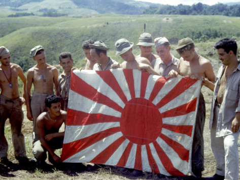 american-soldiers-holding-captured-japanese-flag-on-guadalcanal-island-during-wwii